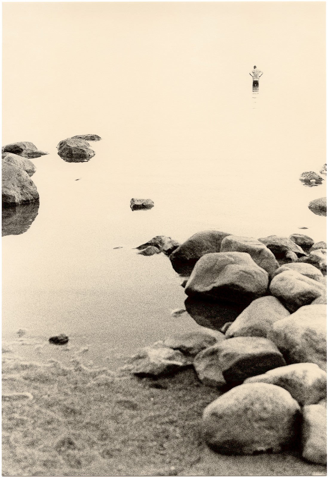 Untitled (rocks and man), silver gelatin photograph by Mikael Siirilä