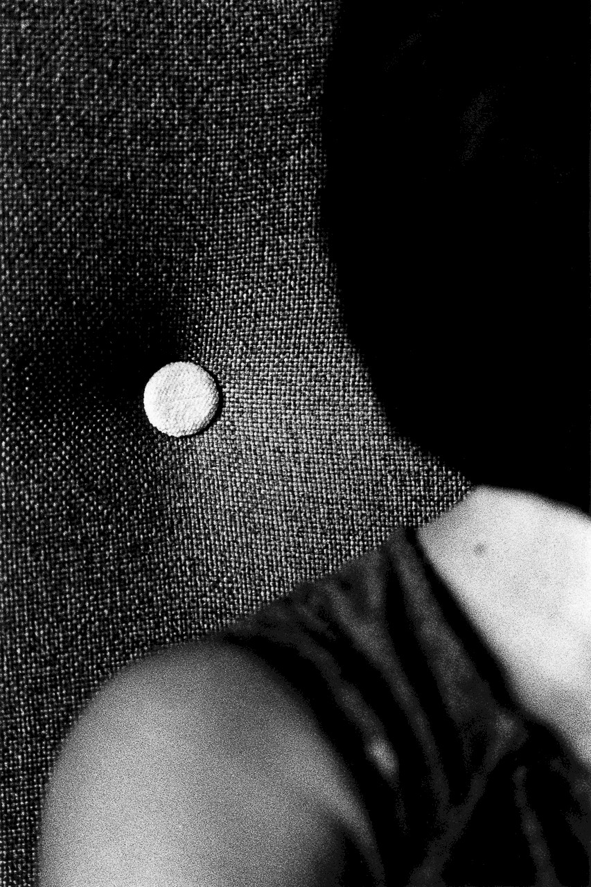 Untitled (shoulder and button), silver gelatin photograph by Mikael Siirilä