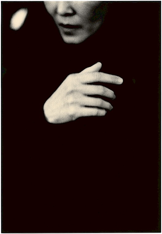Untitled (hand and face), tea-toned silver gelatin photograph by Mikael Siirilä
