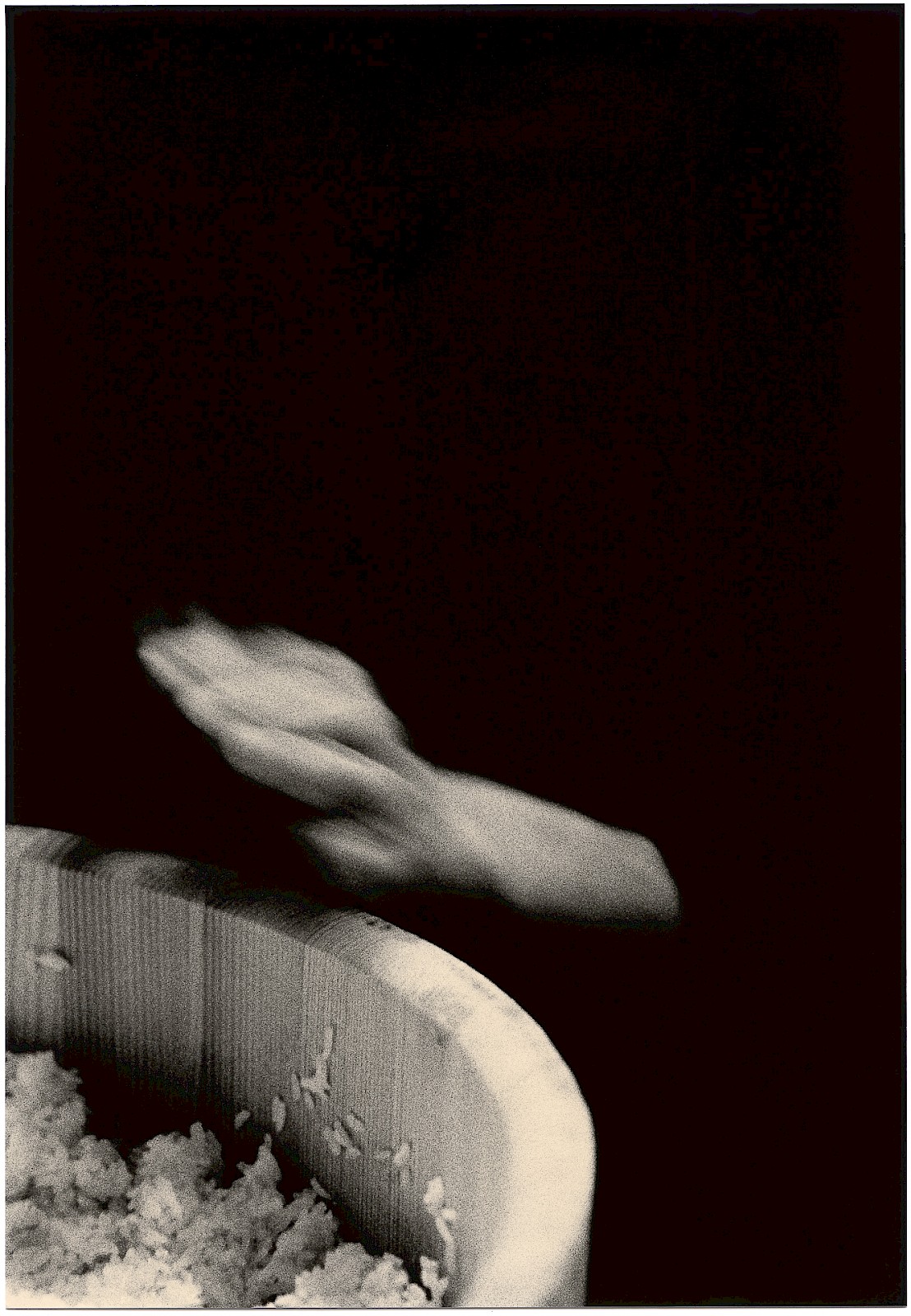 Untitled (hand and rice), silver gelatin photograph by Mikael Siirilä